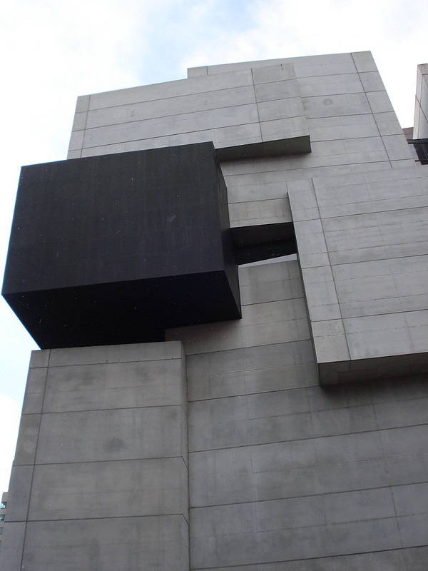 Exterior of a the Contemporary Art Center. Grey and black square panels jut out irregularly from the building..