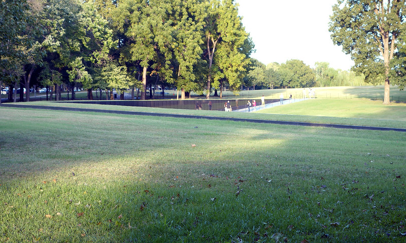 Maya Lin Vietnam Veterans Memorial seen from a distance from the surrounding lawn,