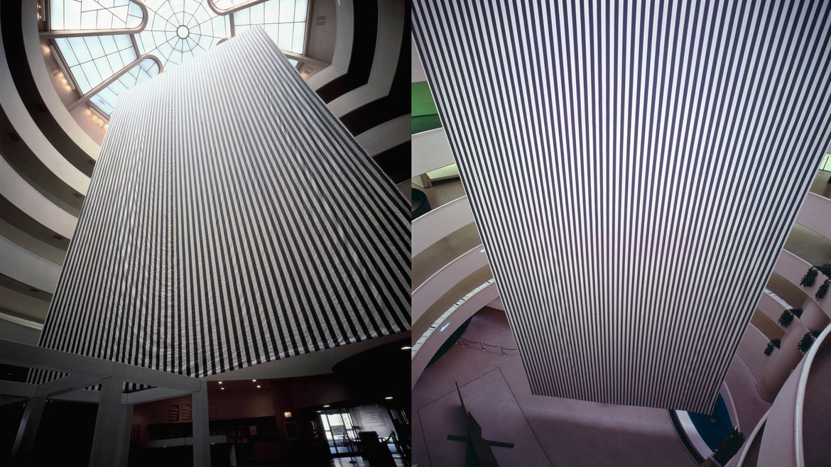 Two views of a large black and white striped banner-like painting hangin in the atrium of the Guggenheim Museum.