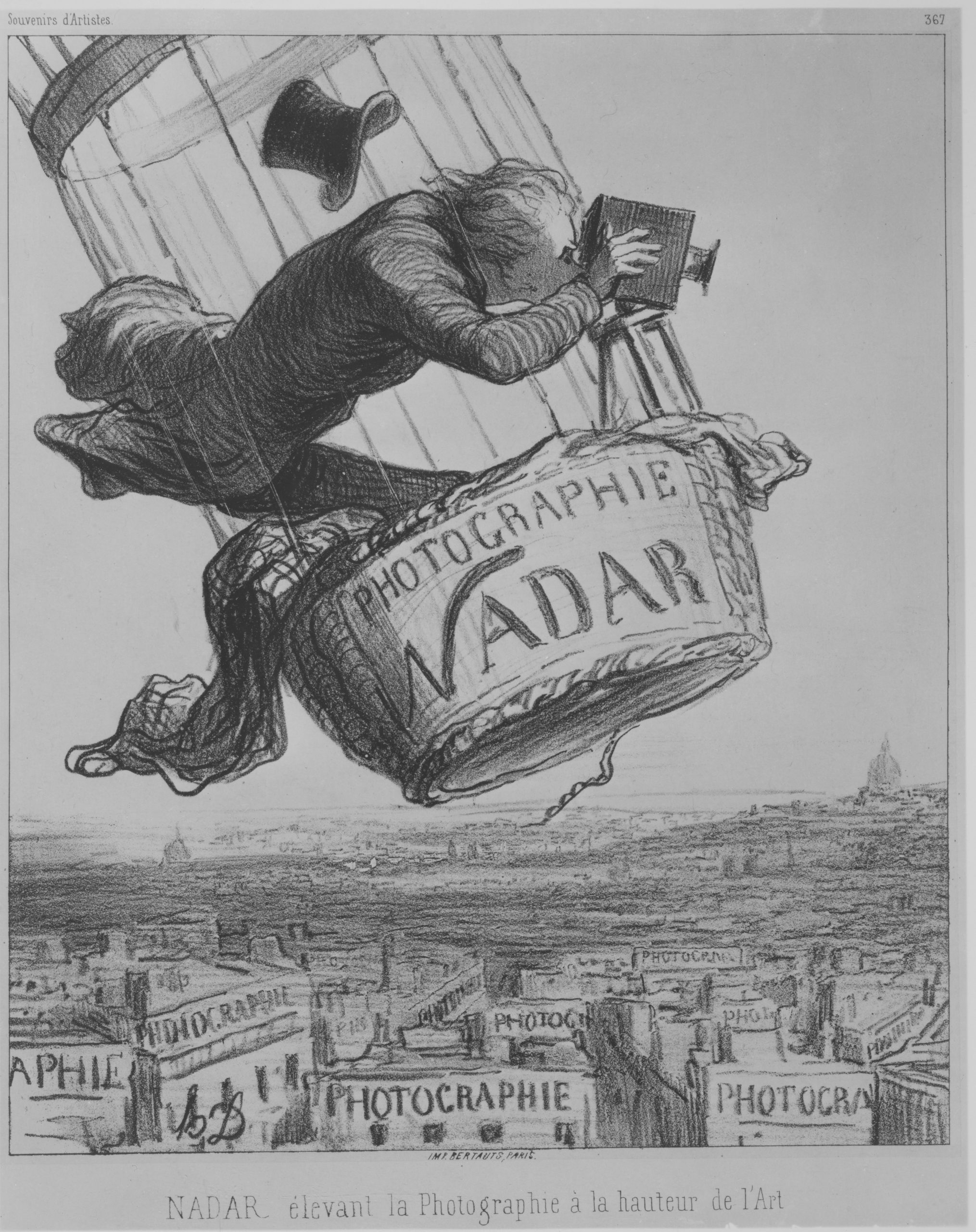 A black and white showing a man in a hot air balloon. He is photographing the city of Paris. This city is full of photographic studios.
