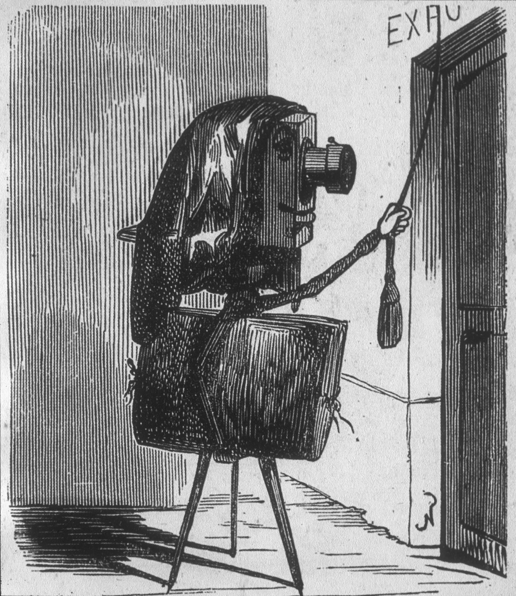 A black and white cartoon showing a camera on a tripod entering a door. The camera is personified and carries a portfolio under their arm.