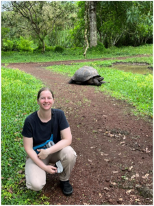 Catherine Creech beside a Galapagos Tortoise