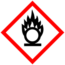 Pictogram is a white diamond outlined in red, with an image in the center. The image shows a circle or O on a flat surface with what appears to be flames rising off its top.