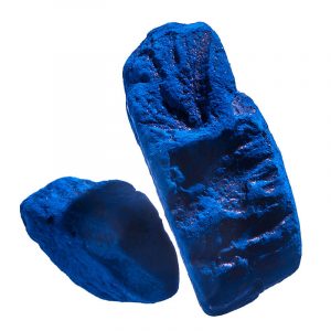An intensely blue colored solid cake of material.
