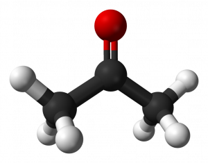 Computer-generaeted image of a ball and stick style model of the same compound. Atoms of carbon are black, hydrogen atoms are white, and the oxygen atom attached by a double bond at carbon 2 is red. The shading on the image is shown in a way that suggests 3D structure.