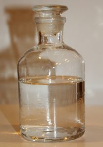 Image of a glass storage jar containing a clear liquid.