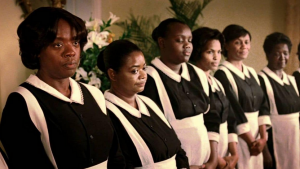 Several maids standing in a row