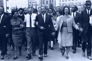 black and white photo of MLK Jr. and marchers on the Selma Bridge in 1965
