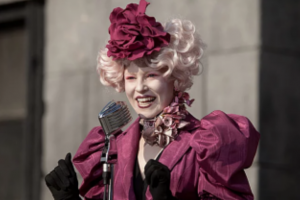 Woman in a magenta hat and jacket