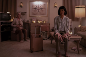 A universe in which humans have evolved to have hot dogs for fingers. In this specific universe, Evelyn (Right, Michelle Yeoh) and Deirdre (Their audit agent, played by Jamie Lee Curtis) are lovers.