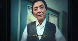 James Hong as Evelyn’s father, Gong Gong. A subtitle caption reads: "I'm sorry it's a girl."