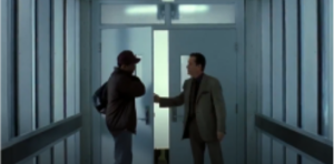 Two men in a hospital corridor