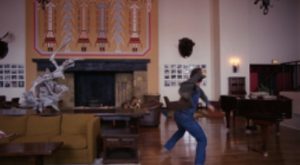 Screen snip of the hotel decorated with Native American themes from The Shining (1980)