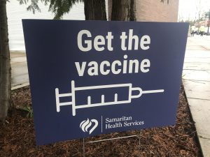 sign saying get the vaccine