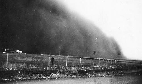 Image shows wind transporting sediment in a dust storm near Okotoks, Alberta, Canada in July of 1933.