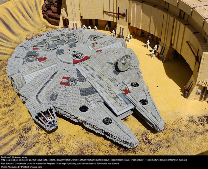 A photo of the Star Wars ship, the Millenium Falcon constructed with lego blocks