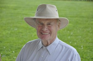photo of an older gentleman smiling and wearing a hat