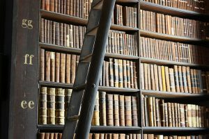 a photograph of the stacks at the Old Library of Trinity College in Dublin