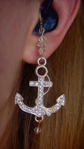 Hearing aid with anchor charm