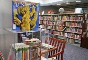 Photograph of a library with shelves of books.