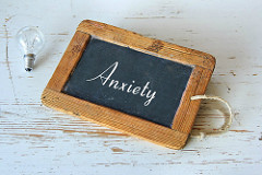 chalkboard with "anxiety" written on it