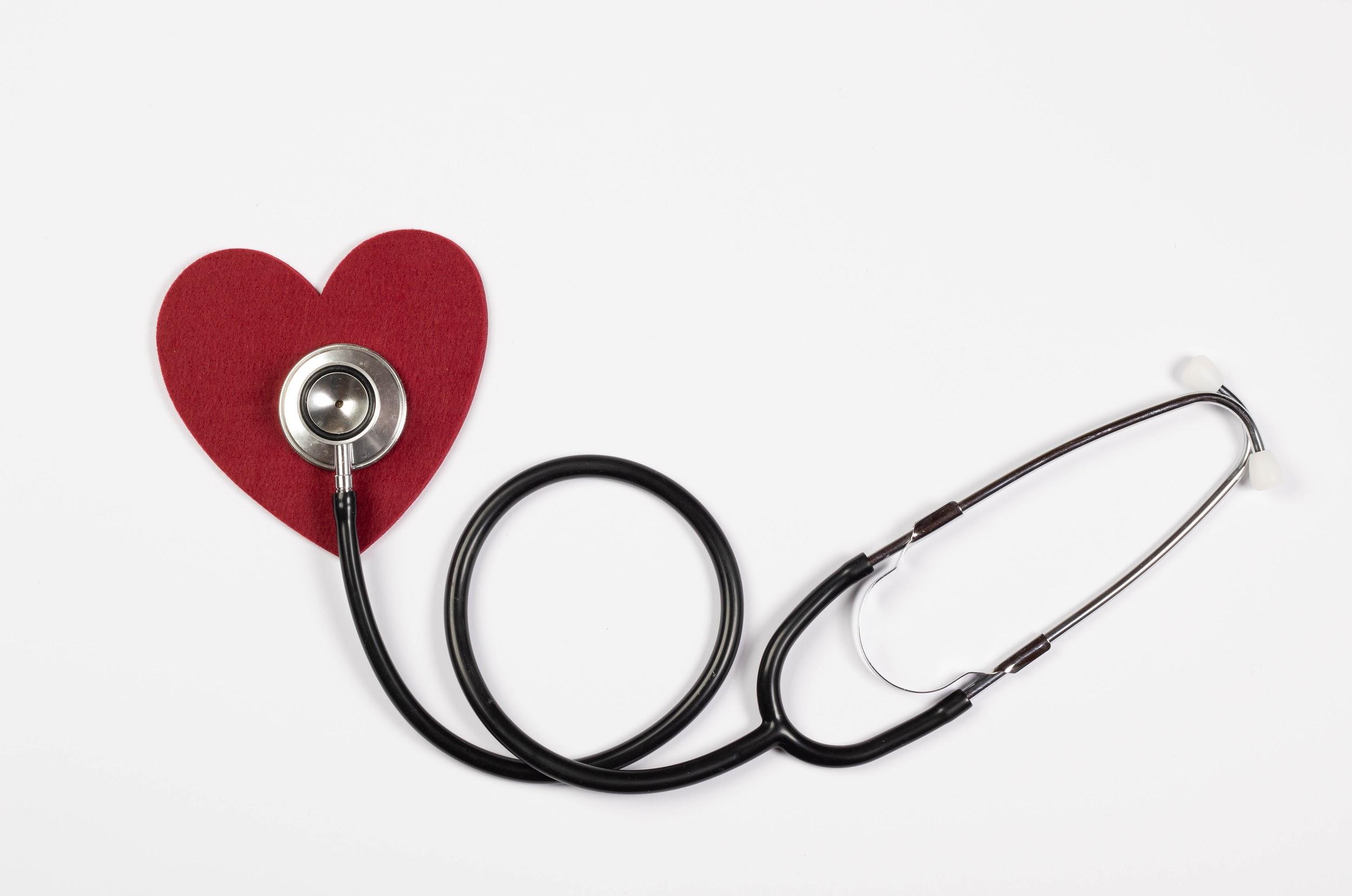A stethoscope with a red paper heart