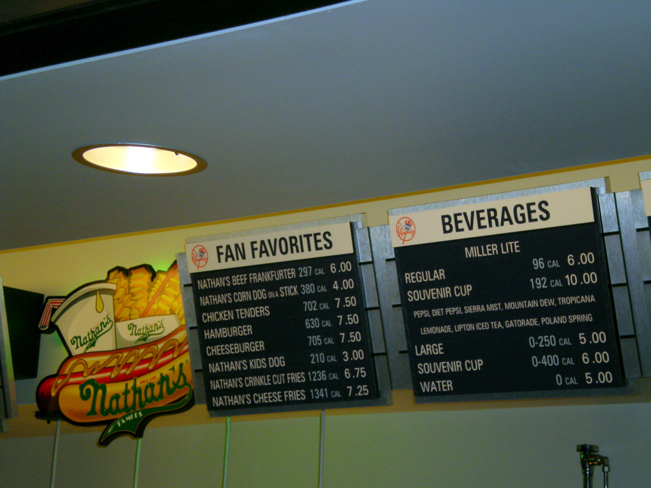 A photo of a Nathan's ballpark menu, showing calorie counts for all items. The highest calorie item is Nathan's Cheese Fries with 1341 calories.