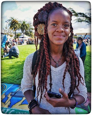 A person with long dreads past their shoulders