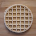 a circular waffle with a square grid pattern