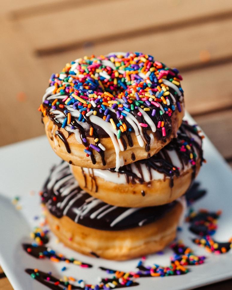 A couple of donuts with sprinkles on them Description automatically generated with medium confidence