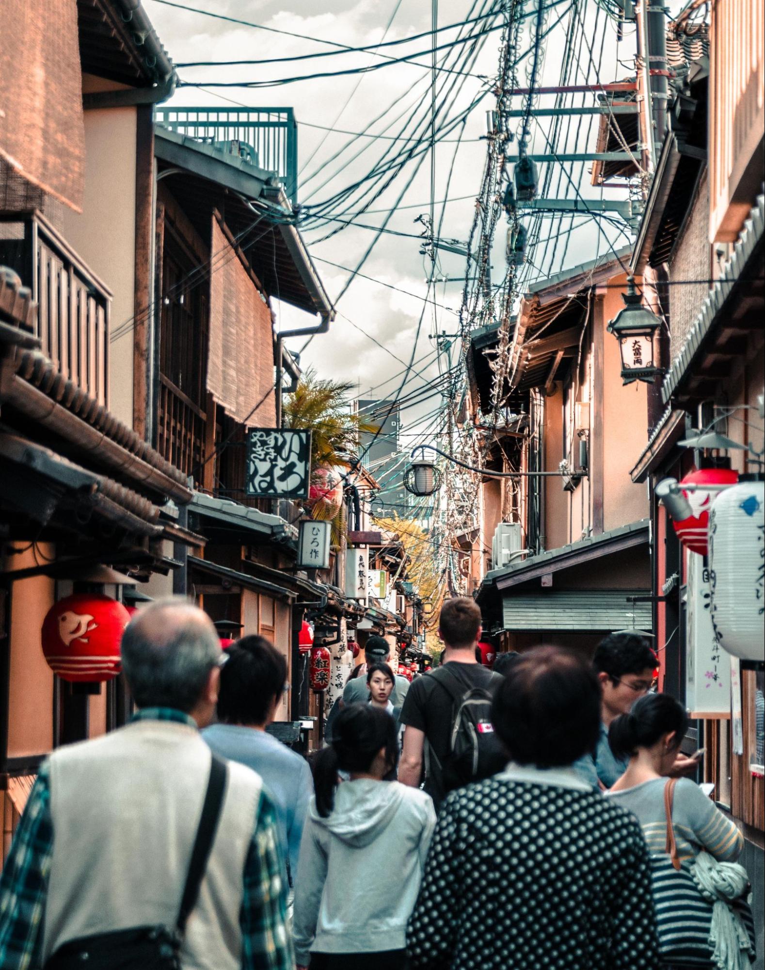 People walking down a crowded street in Tokyo, Japan.