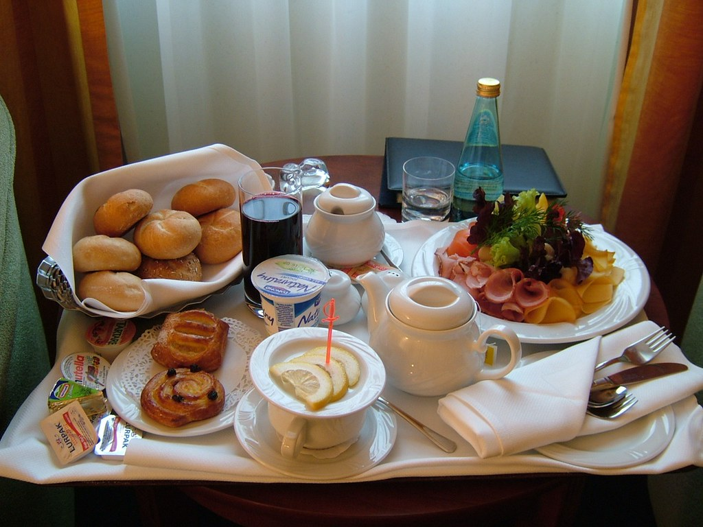 Tray with assorted pastries, condiments and beverages