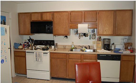 Inside a kitchen, picturing refrigerator, stove, microwave, sink and dishwasher
