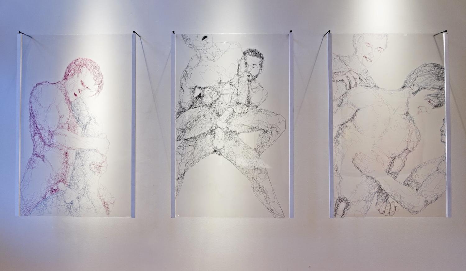 Three panels of thread art depicting nude males.