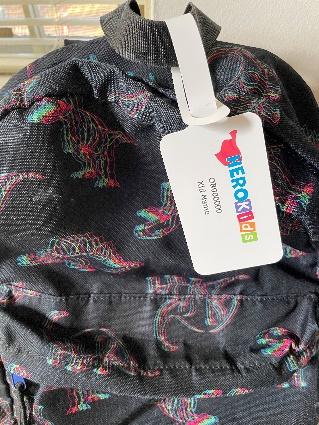 A backpack with a hero kids tag.
