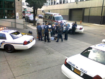 James Chasse lying on the sidewalk in Portland, surrounded by police.