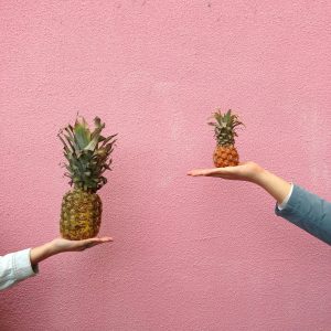 A decorative photo of two different sizes of pineapple to emphasize that we may want to test a hypothesis about the difference between two groups.