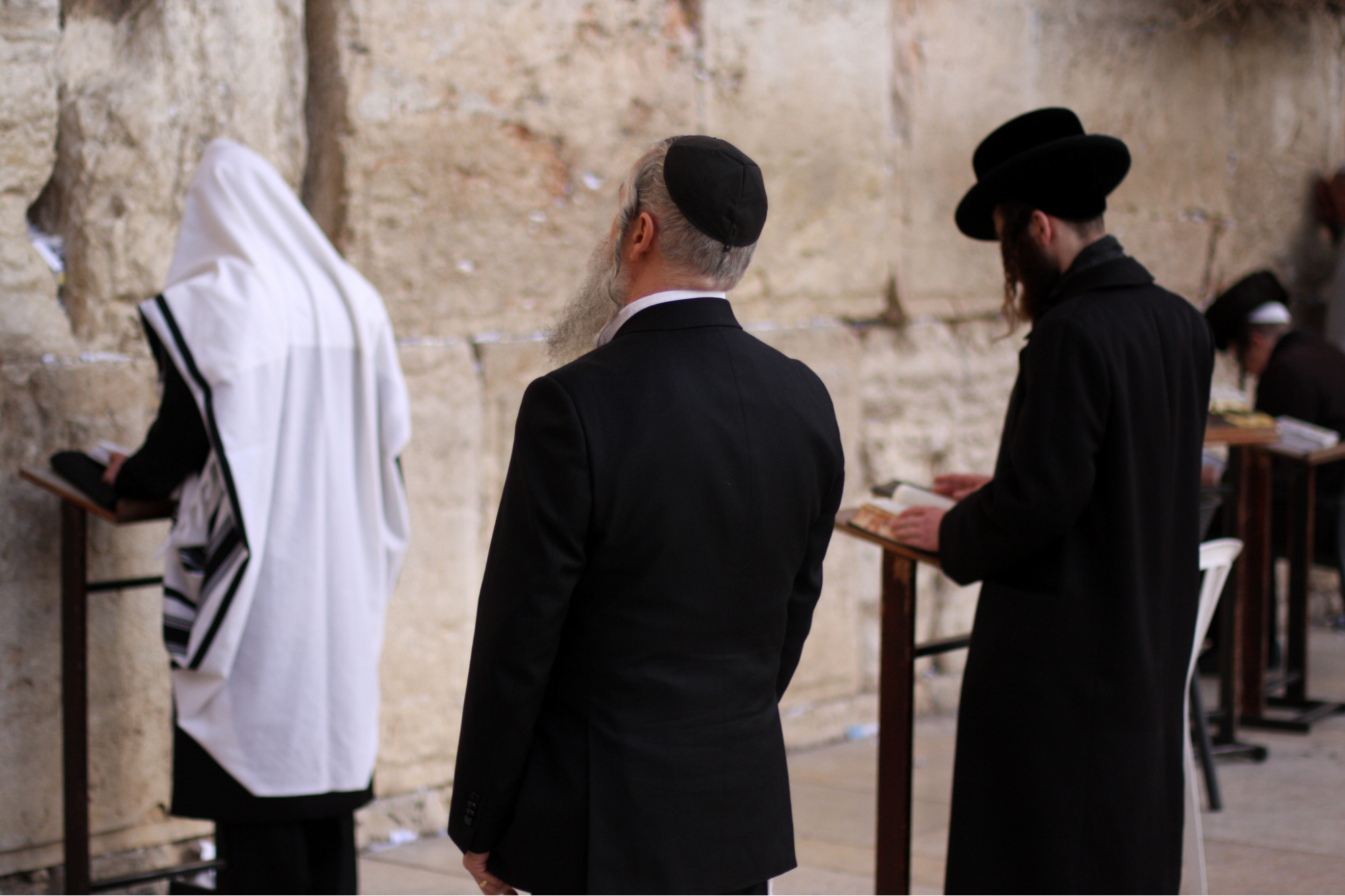 Jewish people pray at the Western Wall