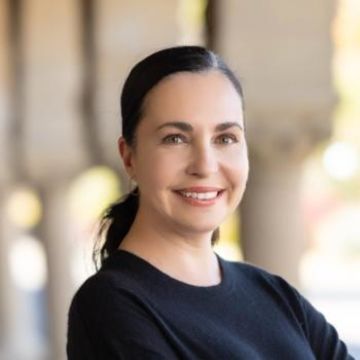 Dr. Angela Garcia wears a dark sweater and smiles at the camera.