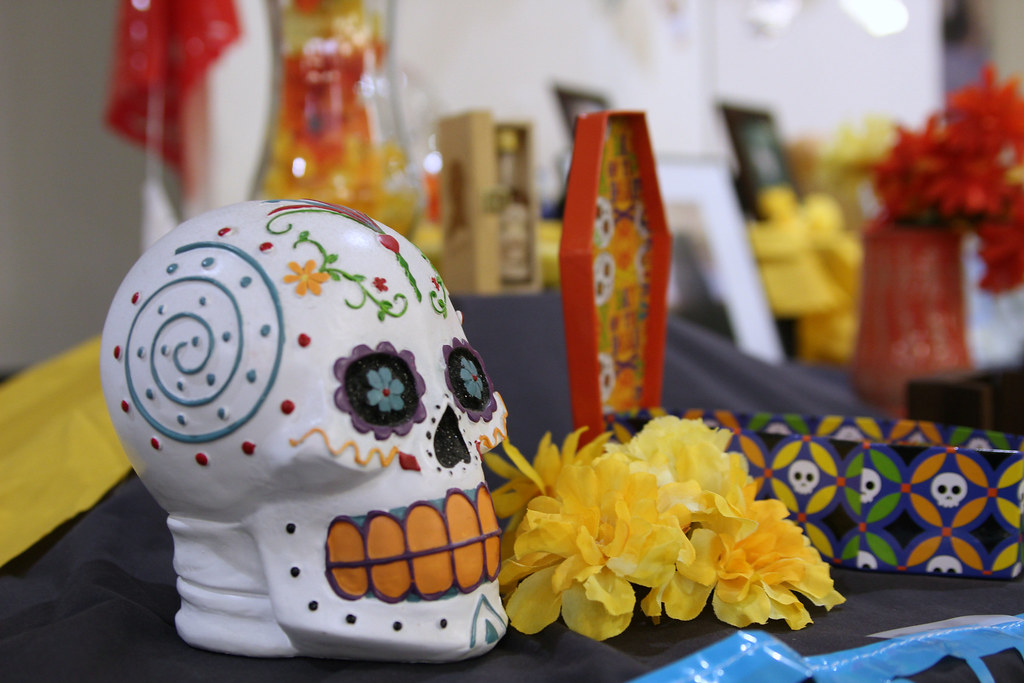 Day of the Dead altar with decorated skull and flowers