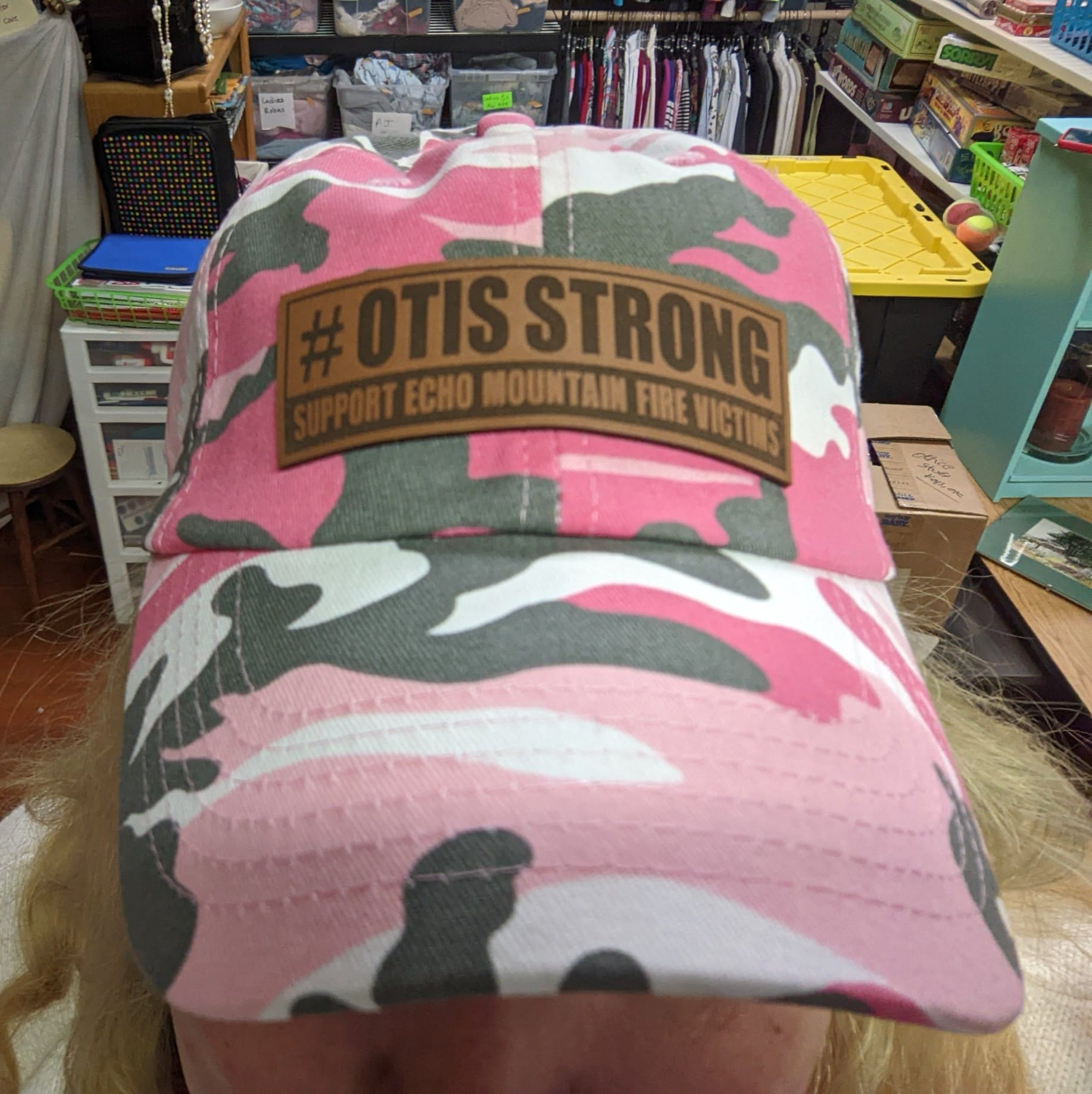 pink camoflague baseball cap with the logo #OtisStrong Support Echo Mountain Fire Victims