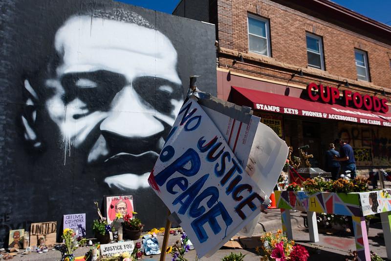 Memorial to George Floyd and a sign reads, "No Justice, No Peace"