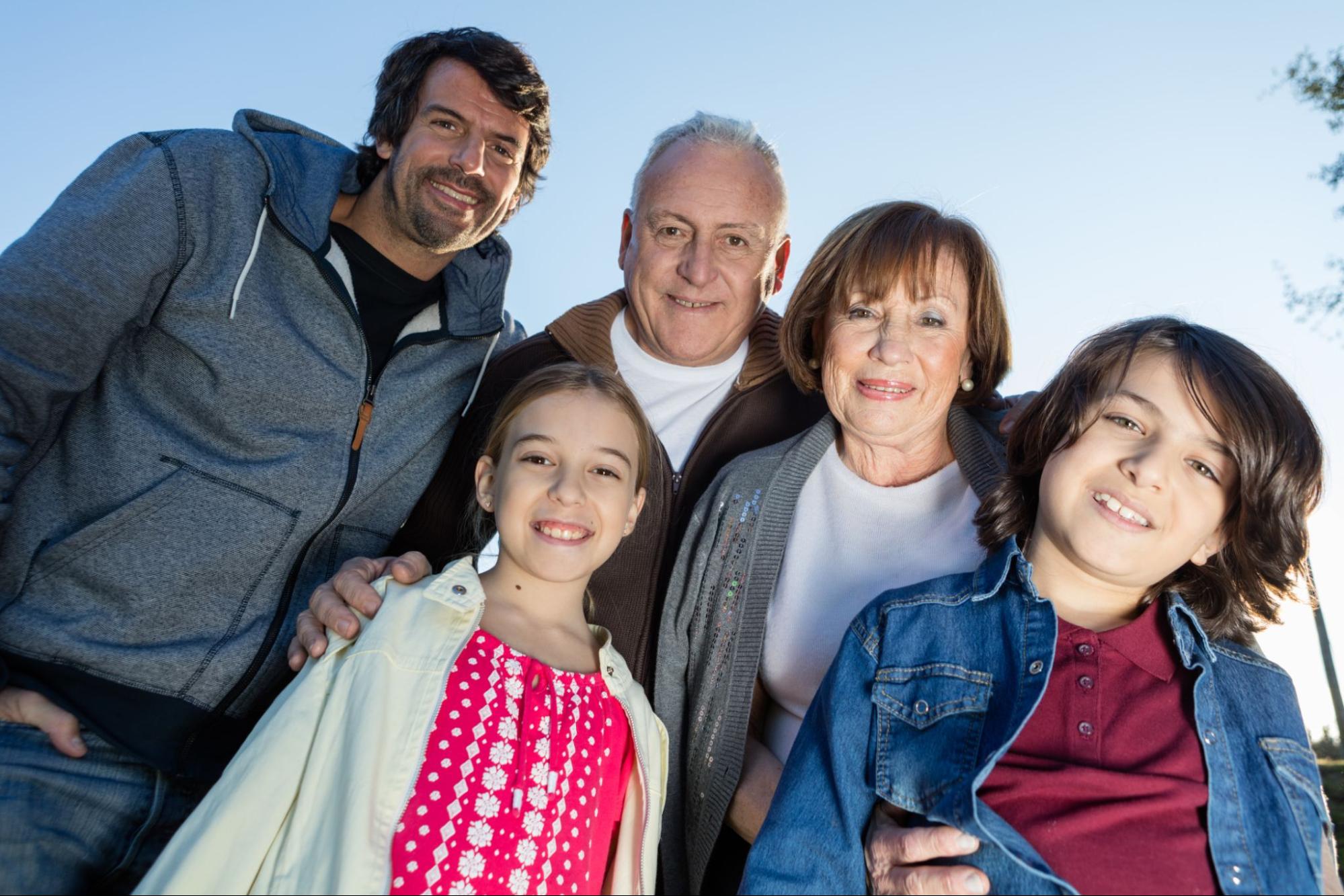 An intergenerational Latinx picture smiles into the camera