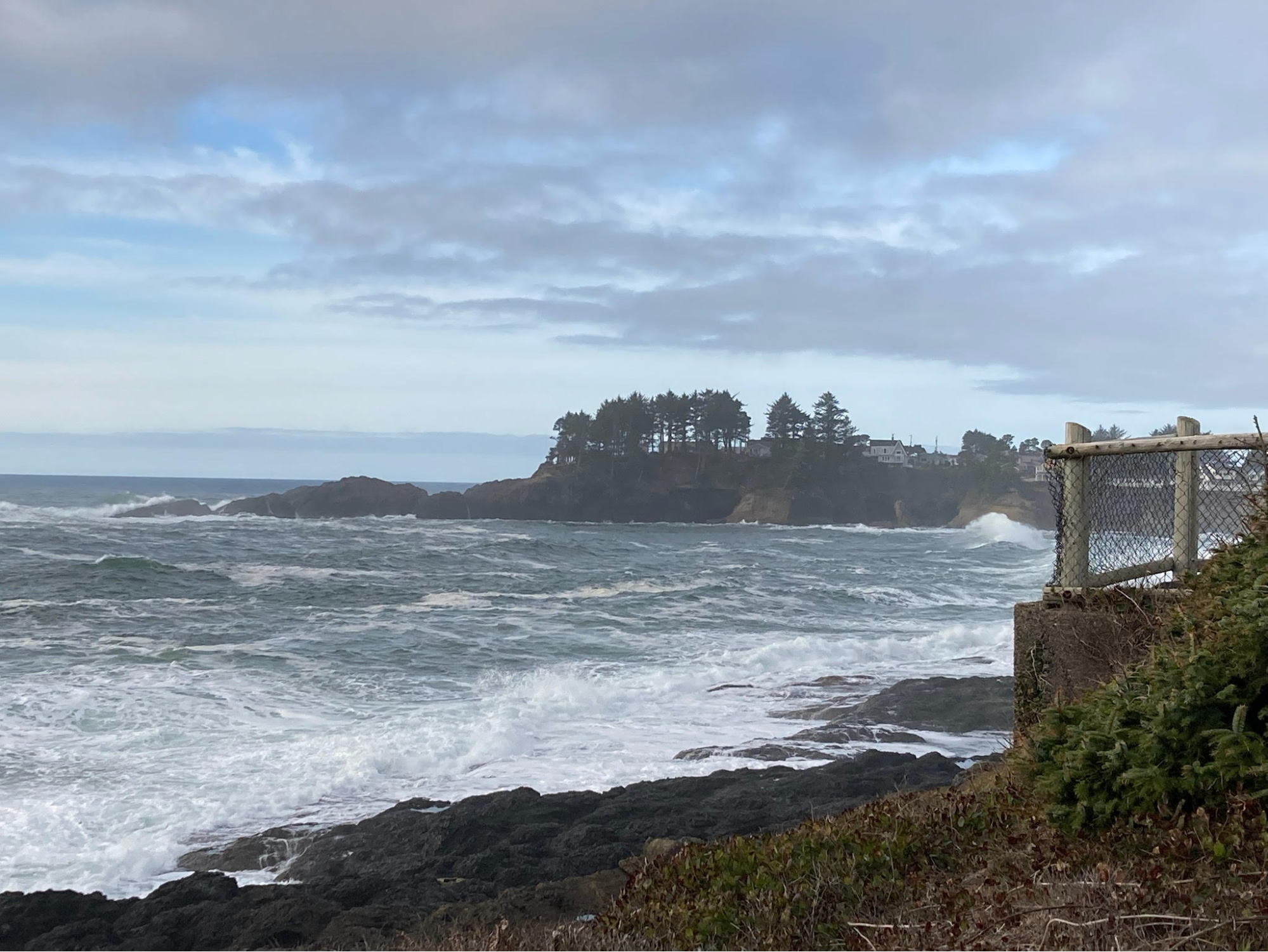 Powerful waves crash on the rocky shore of the Pacific Ocean near Lincoln City OR.