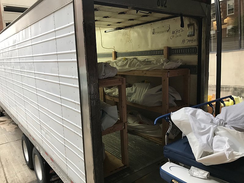 Fig 10.1 Morgue truck with deceased remains wrapped in sheets