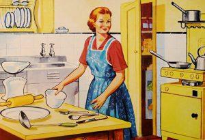 A white woman wearing an apron in a kitchen.