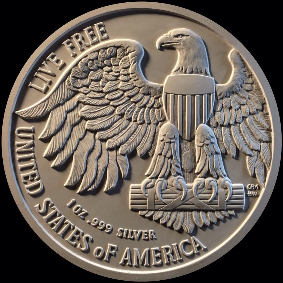 Silver dollar with an eagle and the motto "Live Free"