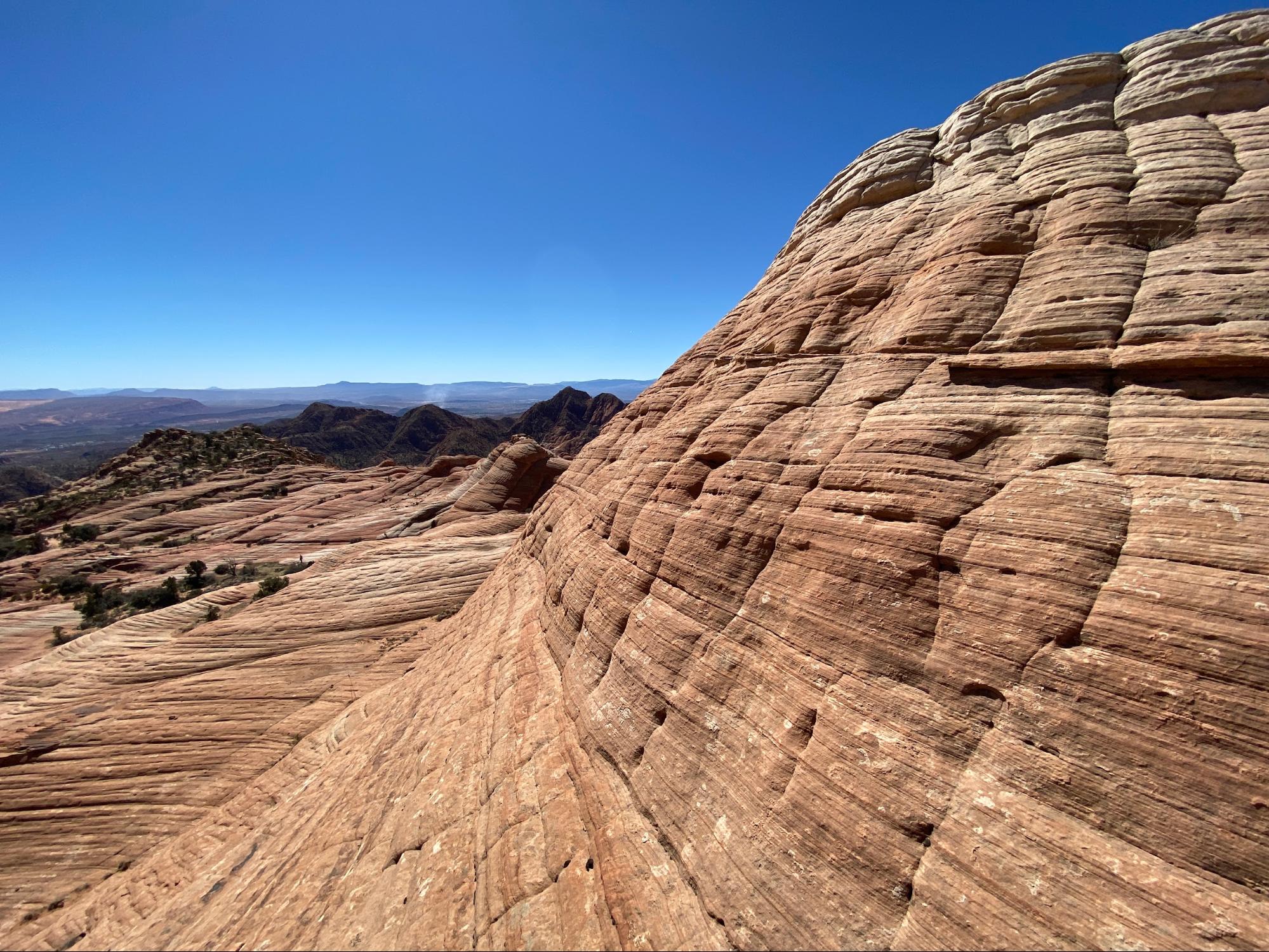 Landscape with geological stratification on a cliffside.