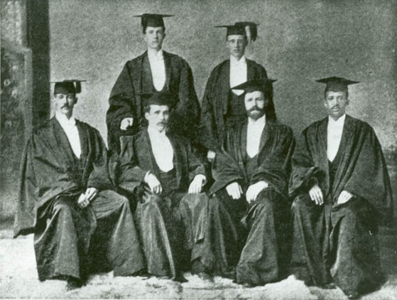 W. E. B. Du Bois and Harvard classmates in their graduation caps and gowns.