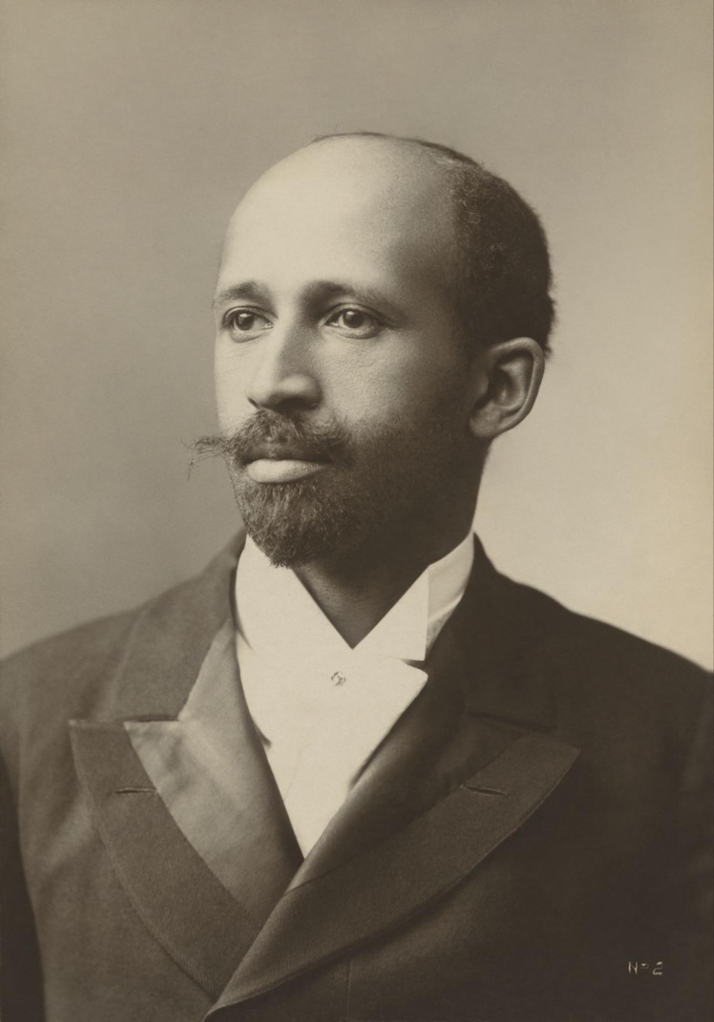 W. E. B. Du Bois in a formal suit jacket in a sepia-toned photograph